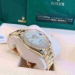 Rolex Day-Date 36 Mother of Pearl Dial Gold Diamond Bezel Watch 128348RBR-0017 128348RBR