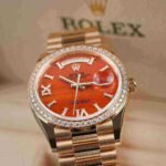 Rolex Day-Date 36 Carnelian Dial Gold Diamond Bezel Watch 128348RBR-0049 128348RBR