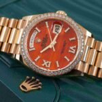 Rolex Day-Date 36 Carnelian Dial Gold Diamond Bezel Watch 128348RBR-0049 128348RBR